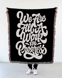 "We Are All a Work in Progress" Woven Art Blanket by Mark Caneso