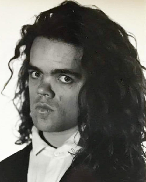 A Young Peter Dinklage working that 80’s Haircut like Milli Vanilli.